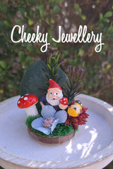 The cutest mini Gnome themescapes mini on a wood slice, with crystal.