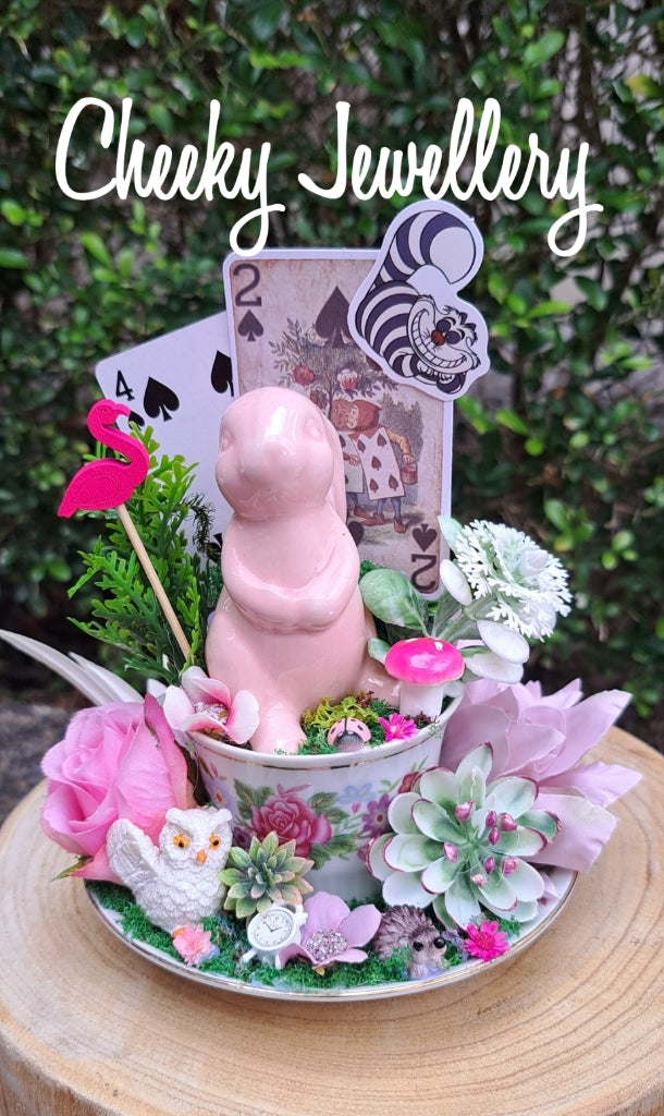 Alice in wonderland inspired centrepieces on glass stand