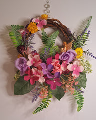 Fairy rattan wreath with glitter winged fairy in floral setting. decor gift for fairy lovers. Christmas, gifts, decor, special gifts.