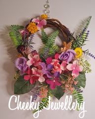 Fairy rattan wreath with glitter winged fairy in floral setting. decor gift for fairy lovers. Christmas, gifts, decor, special gifts.