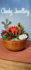 Cute Dinosaur themescape garden with green crystal and prehistoric greenery. Imagination play, creative play for kids. Great gift ideas.
