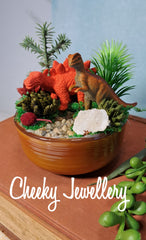 Cute Dinosaur themescape garden with green crystal and prehistoric greenery. Imagination play, creative play for kids. Great gift ideas.