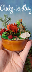 Cute Dinosaur themescape garden with green crystal and prehistoric greenery. Imagination play, creative play for kids. Great gift ideas.
