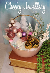 Cute as a button easter winter garden, with bronze bunny with pink and snowy setting.