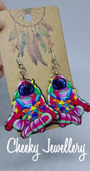 Groovy space dangly earrings