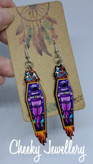 Groovy space dangly earrings