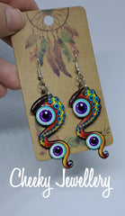 Groovy space dangly earrings